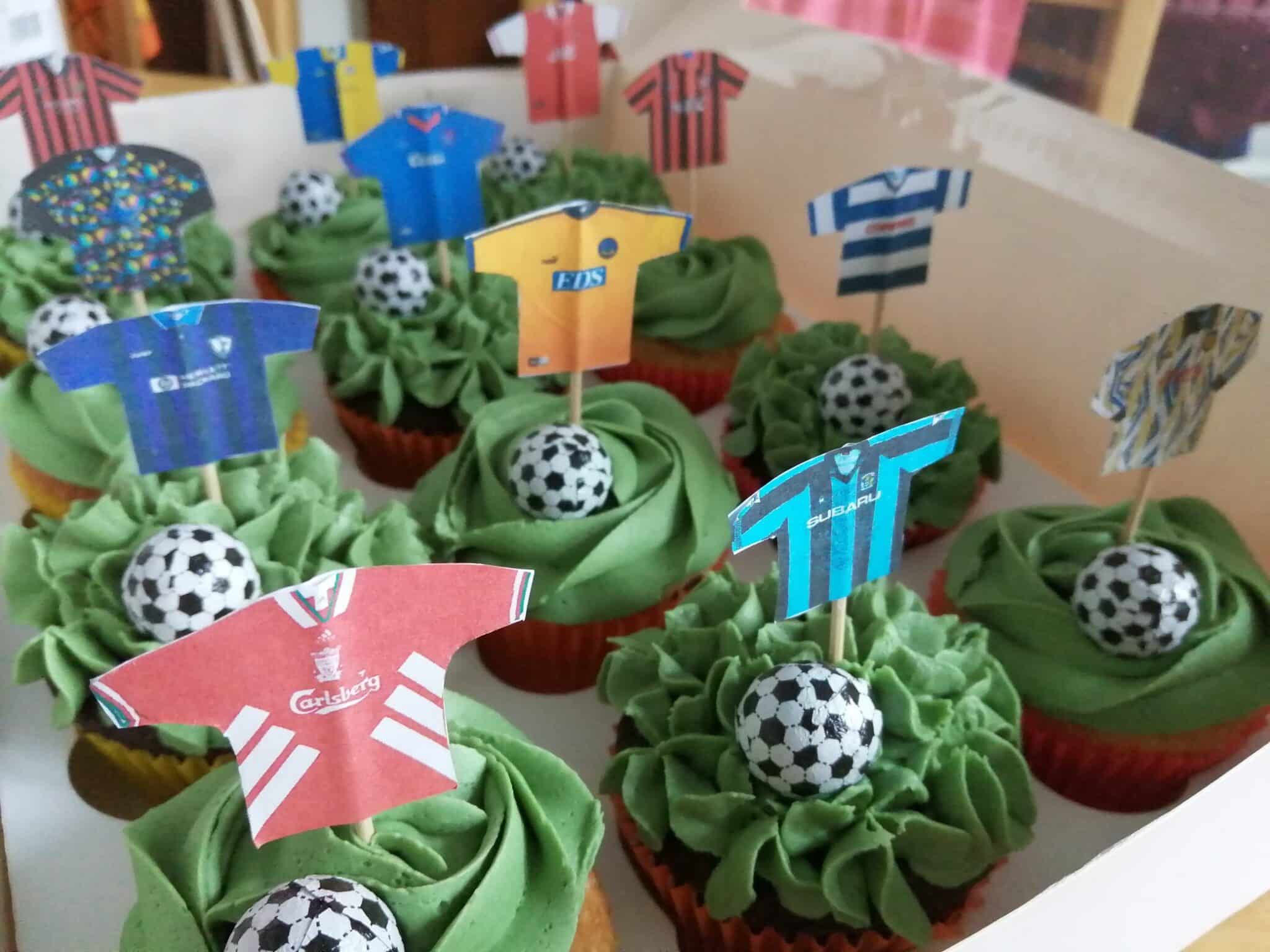 A selection of 90s cupcakes with football toppers