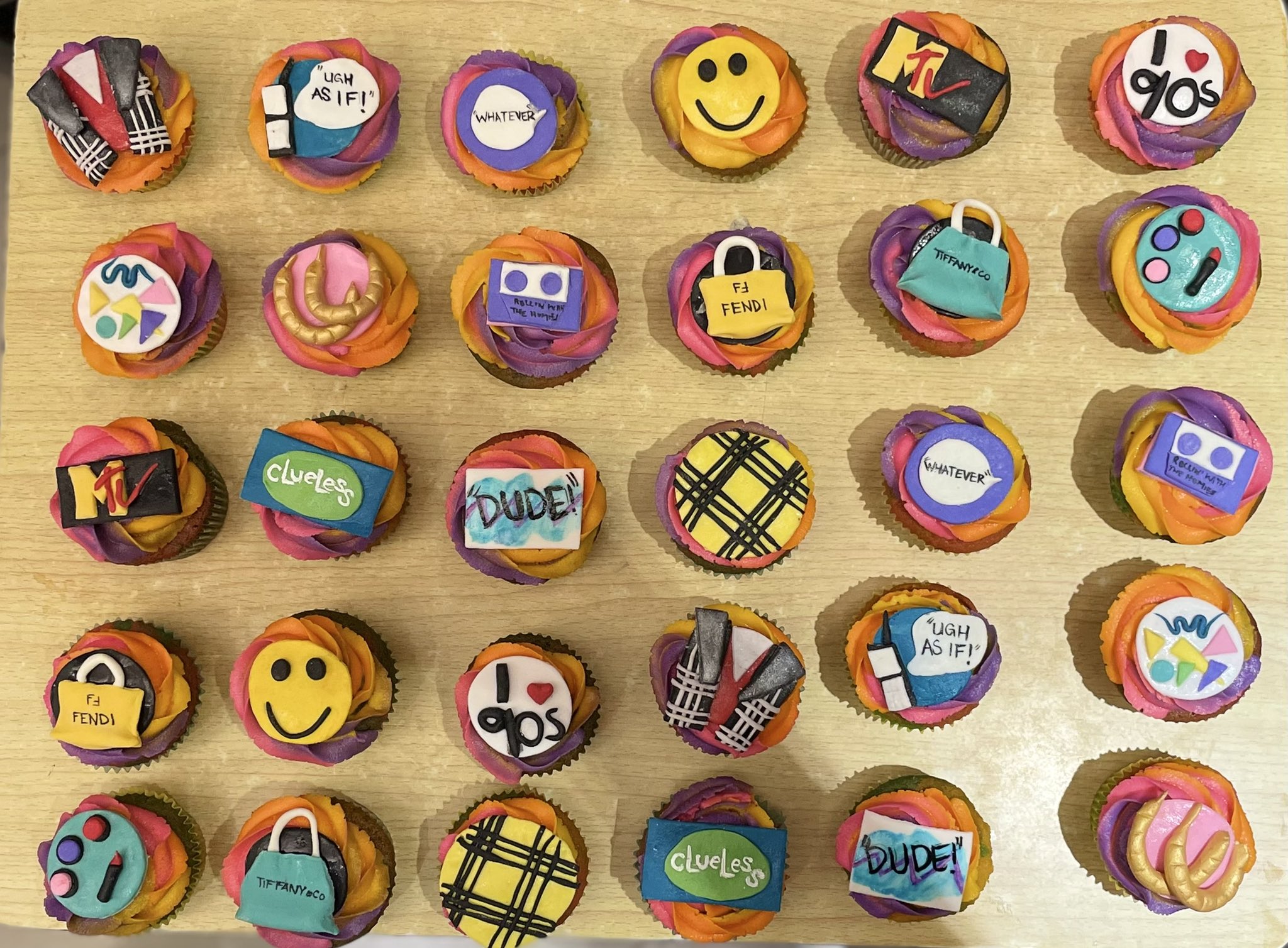 A selection of 90s cupcakes with all things retro