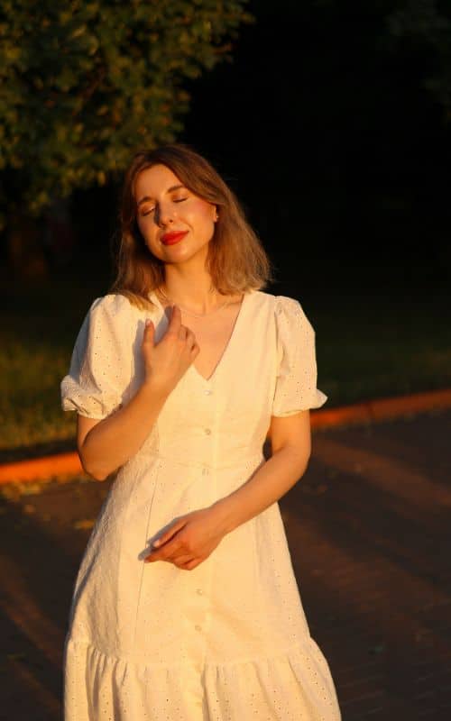a woman wearing white Babydoll Dress - short and loose-fitting