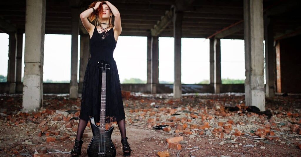 woman with guitar wearing 90s grunge dress